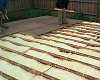 CSR Bradford bulk sub-floor insulation  installed. Yellow tongue flooring being immediately installed by carpenters.