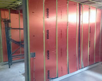Rmax ThermaAdvantage boards neatly installed after furring channels had been installed (cut between channels).